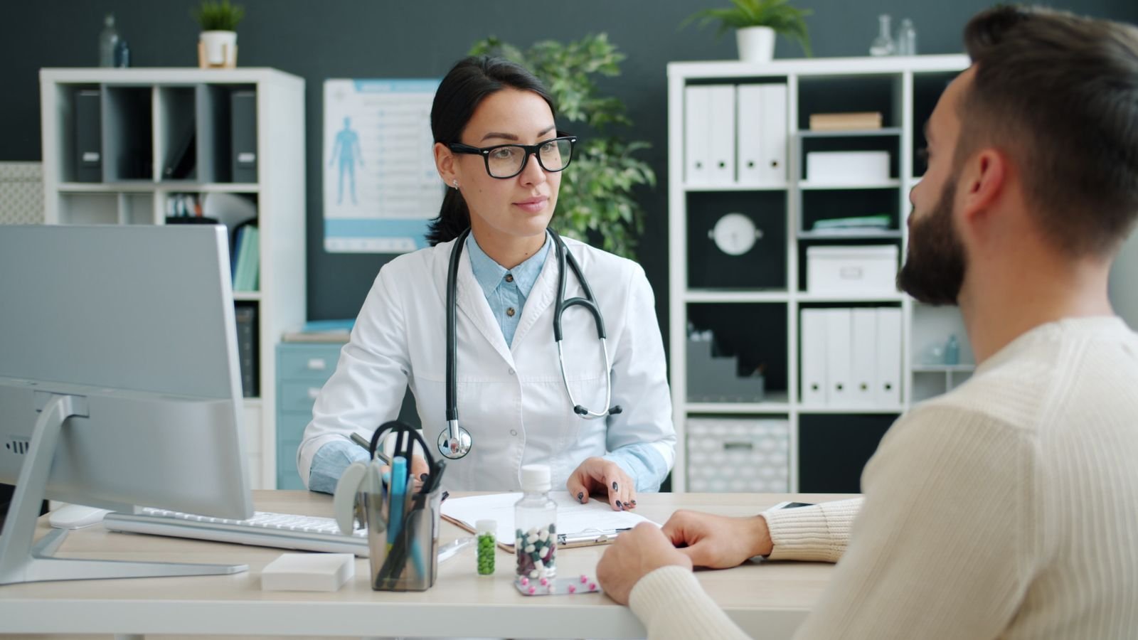 Smiling doctor at her clinic desk